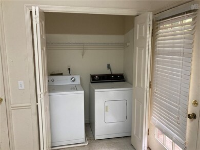 Laundry located in the kitchen.