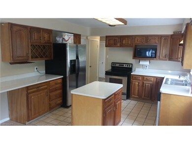 Spacious kitchen with movable center island.  All 