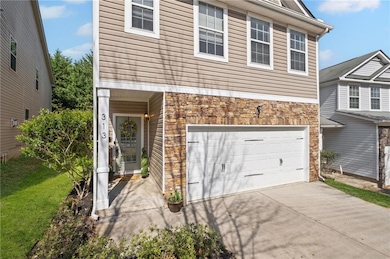 View of front facade featuring a front yard, an at