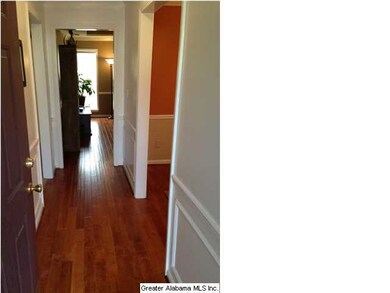 The foyer with beautiful hardwood flooring!