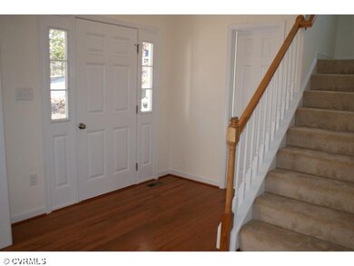 Foyer - Two-story foyer with wood floors