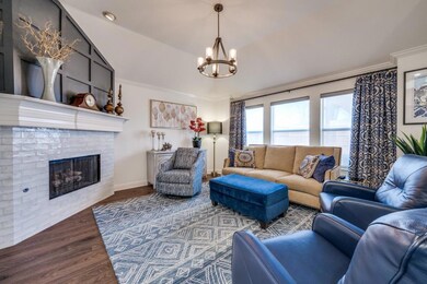 Living area with wood finished floors, baseboards,