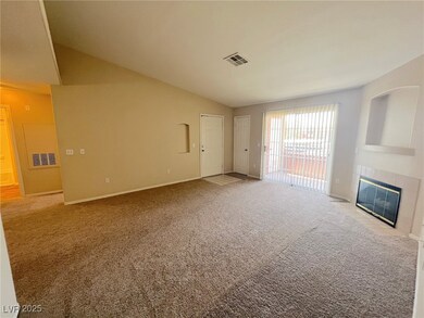 Unfurnished living room with a fireplace, vaulted