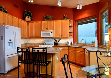lots of cabinets, granite and new tile