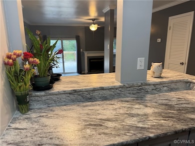 Open concept with pass through from kitchen to din