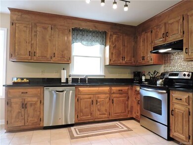 Kitchen with granite counter tops.