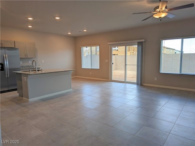 Kitchen with stainless steel refrigerator with ice