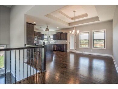HARDWOOD IN KITCHEN/DINING AREA IS STANDARD.   FAN