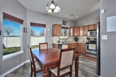 The dining area is open to the living room and adj