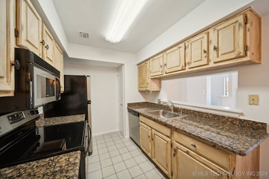 Kitchen open to dining and living.