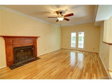 Large Hardwood Living Room with French Door access