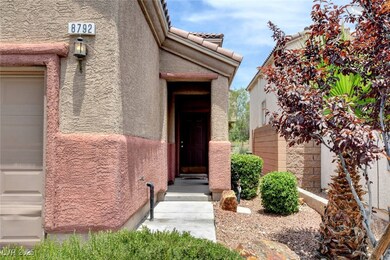 Doorway to property featuring stucco siding