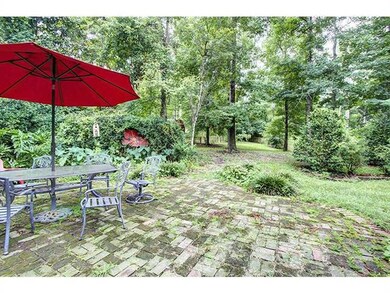 Exterior Back. Brick patio with small fenced in ar
