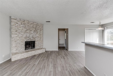 Unfurnished living room featuring visible vents, 