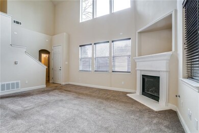 Bright family room with gas log fire place and gas