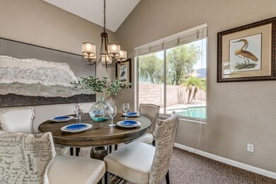 Formal dining with a view of the pool.