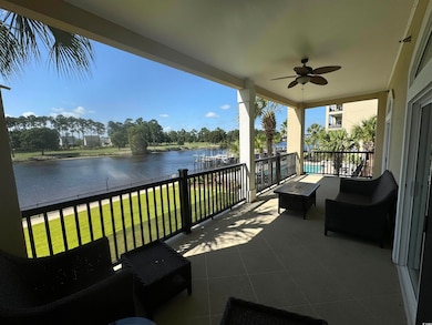 View of patio featuring ceiling fan, a balcony, an