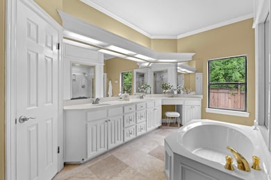 Bathroom featuring a sink, double vanity, ornamen