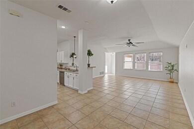 Unfurnished living room featuring ceiling fan, lig