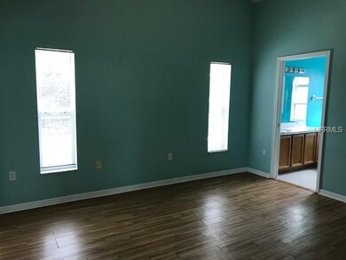 Master is big with door and windows to the pool de