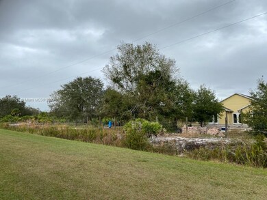 Beautiful house being built next to the lot. Lot is just left of the new house.
