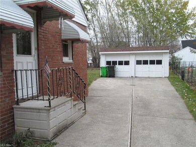 This brick Cape Cod has a paved driveway and two c