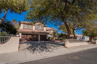 Mediterranean / spanish home featuring stucco siding, a tiled roof, concrete driveway, and a garage