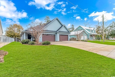 View of front of property with fence, an attached 