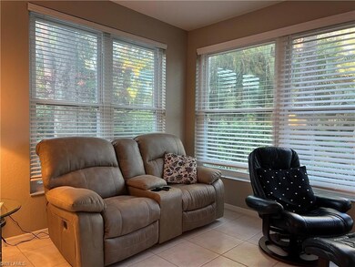 Dining room with baseboards, a ceiling fan, and li