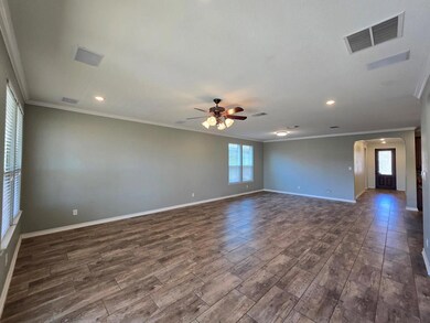 Empty room featuring plenty of natural light, a c
