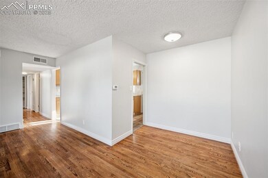 Dining area featuring original hardwood floors and