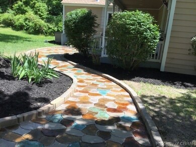 Custom painted stamped concrete sidewalk to home