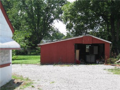 This detached one car garage also has a potting shed/workshop in it.
