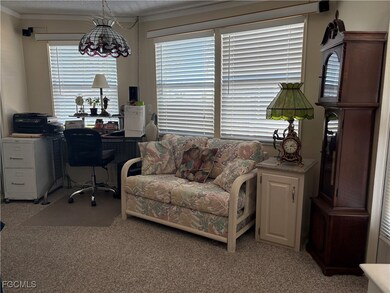 Office with light carpet, a textured ceiling, and crown molding