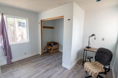 Bedroom featuring light wood finished floors and baseboards