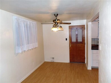 Dining Room with Ceiling Fan and Door to Back Porc