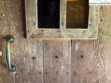 Front door accented with nails from the Virginia C