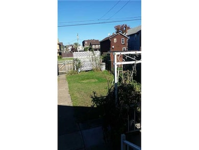 Exterior Back. LEVEL BACK YARD WITH ROOM FOR GARDE