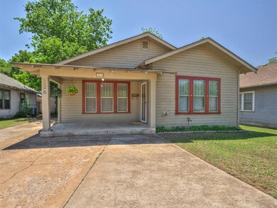 Bungalow-style house featuring a front lawn and a 