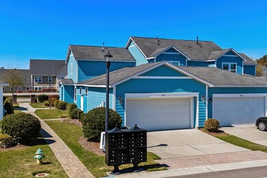 Multi unit property featuring driveway, a garage, 