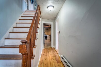 Main entry with refinished pine floors