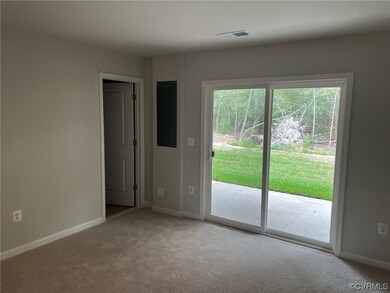 Carpeted empty room featuring plenty of natural light