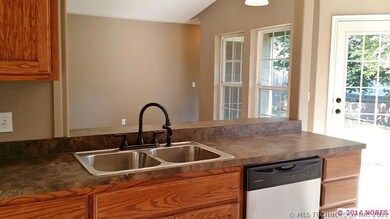 Kitchen open to living. New stainless steel dishwa