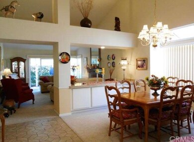 Lovely dining room has large garden window.