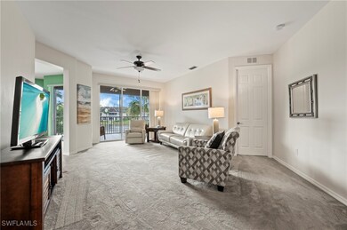 Living area with carpet floors and a ceiling fan