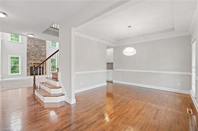 Your point of view as you enter the front door.  Lots of natural light, 2 story ceilings and a stone fireplace.