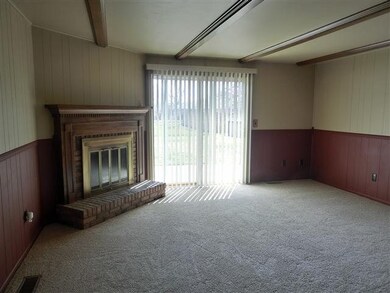 Separate family room with woodburning fireplace
