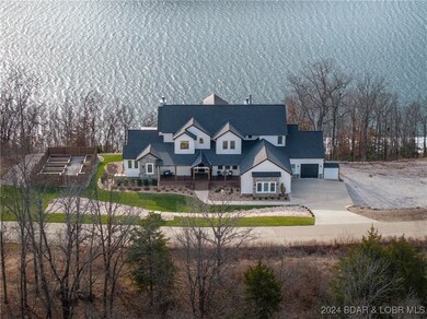 This modern farmhouse boasts 360 foot of Lake Fron