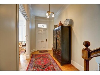 Spacious Foyer. Note the beautiful crown molding.