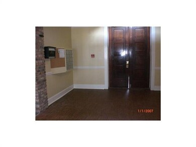Foyer. Freshly painted walls and new flooring in t